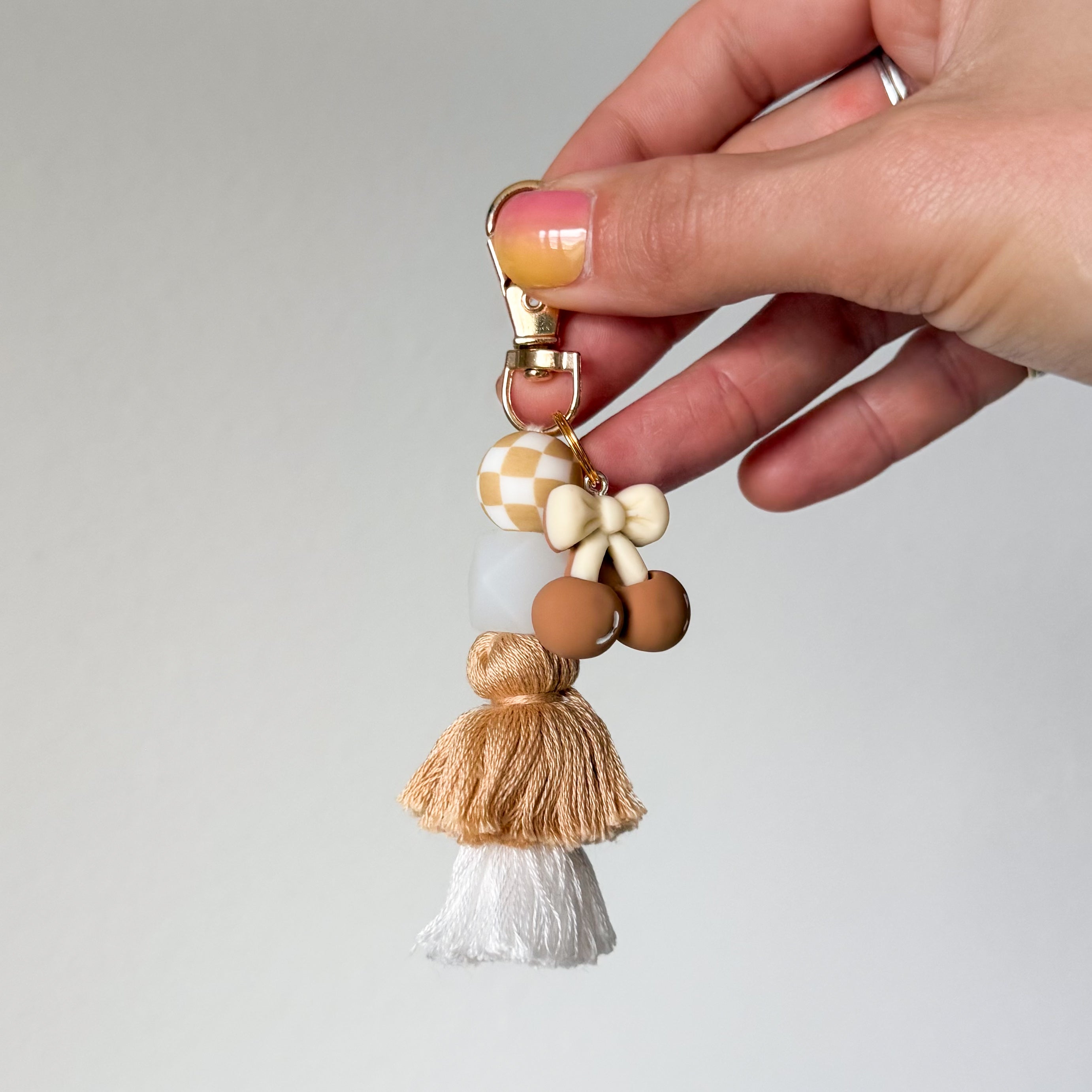 Tan Cherry Bow Tassel Keychain